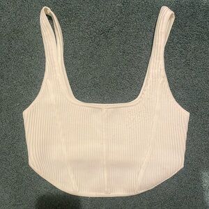 A white forever 21 crop top. It is a medium but is very stretchy and fits L-XL.